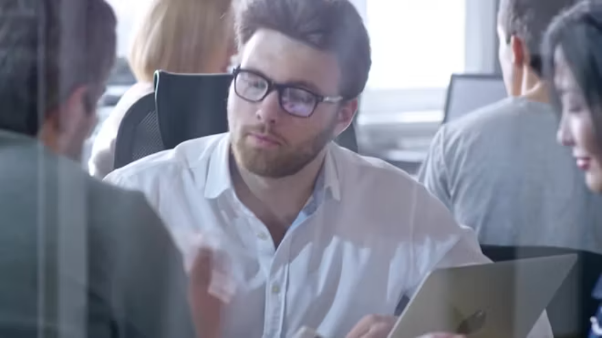 Professionals reviewing contracts, documents and obligations through a controlled process.