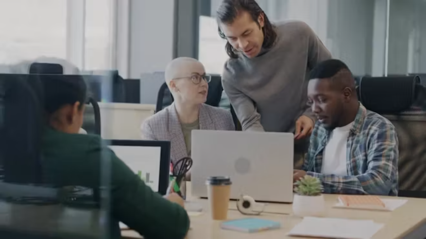 Marketing and business team reviewing campaign work before release.