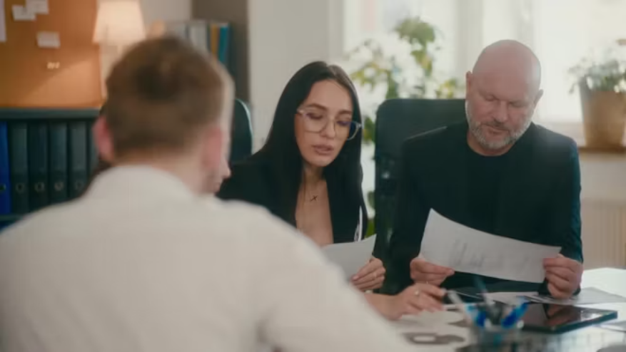 Marketing and business team reviewing campaign work before release.